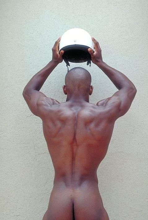 20P Naked ebony gay loves flashing his huge cock while posing