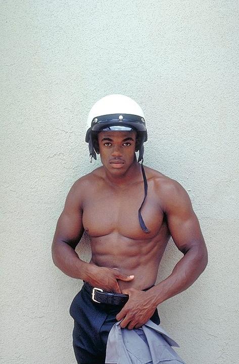 20P Naked ebony gay loves flashing his huge cock while posing