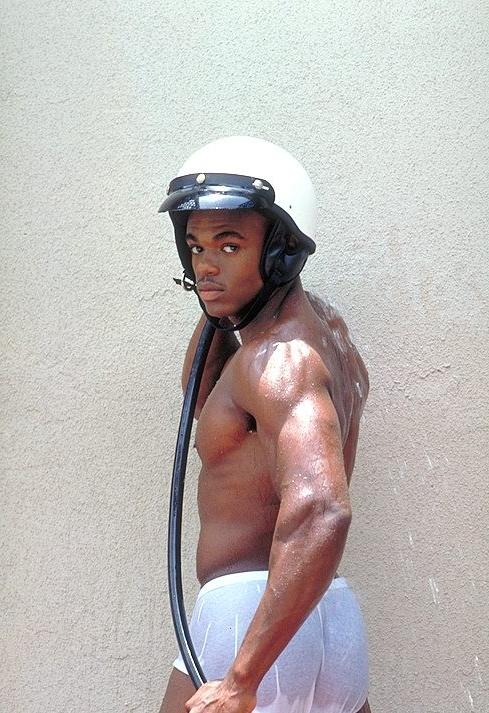 20P Naked ebony gay loves flashing his huge cock while posing