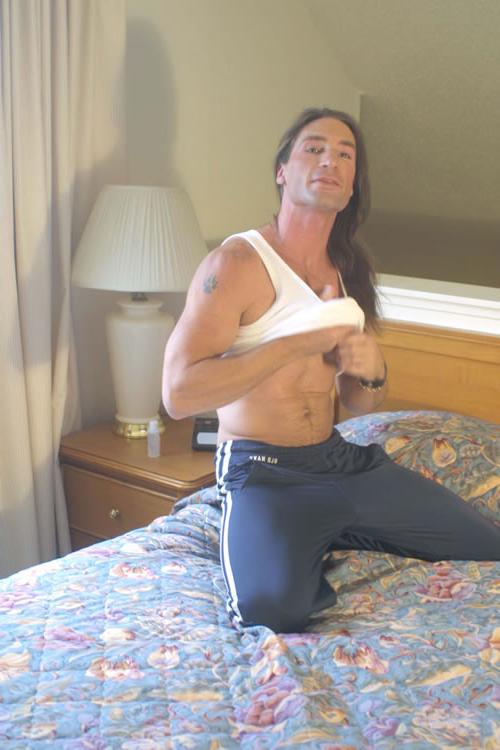 20P Hairy brunette gay in bed showing his cock