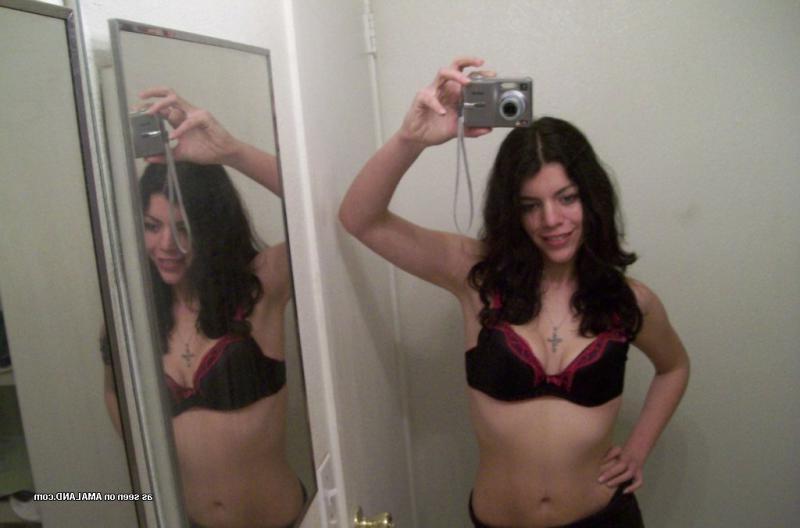 14P Tattooed Spanish hottie strips naked while selfhooting