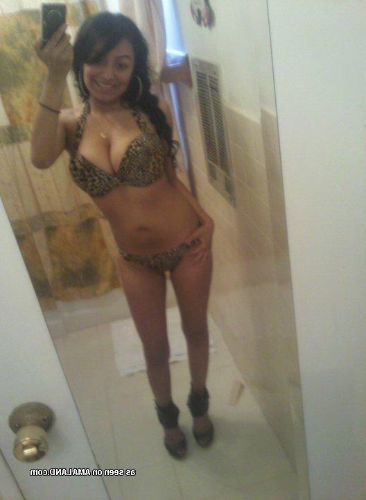 9P Spanish babe displays her big tits in various sexy clothes