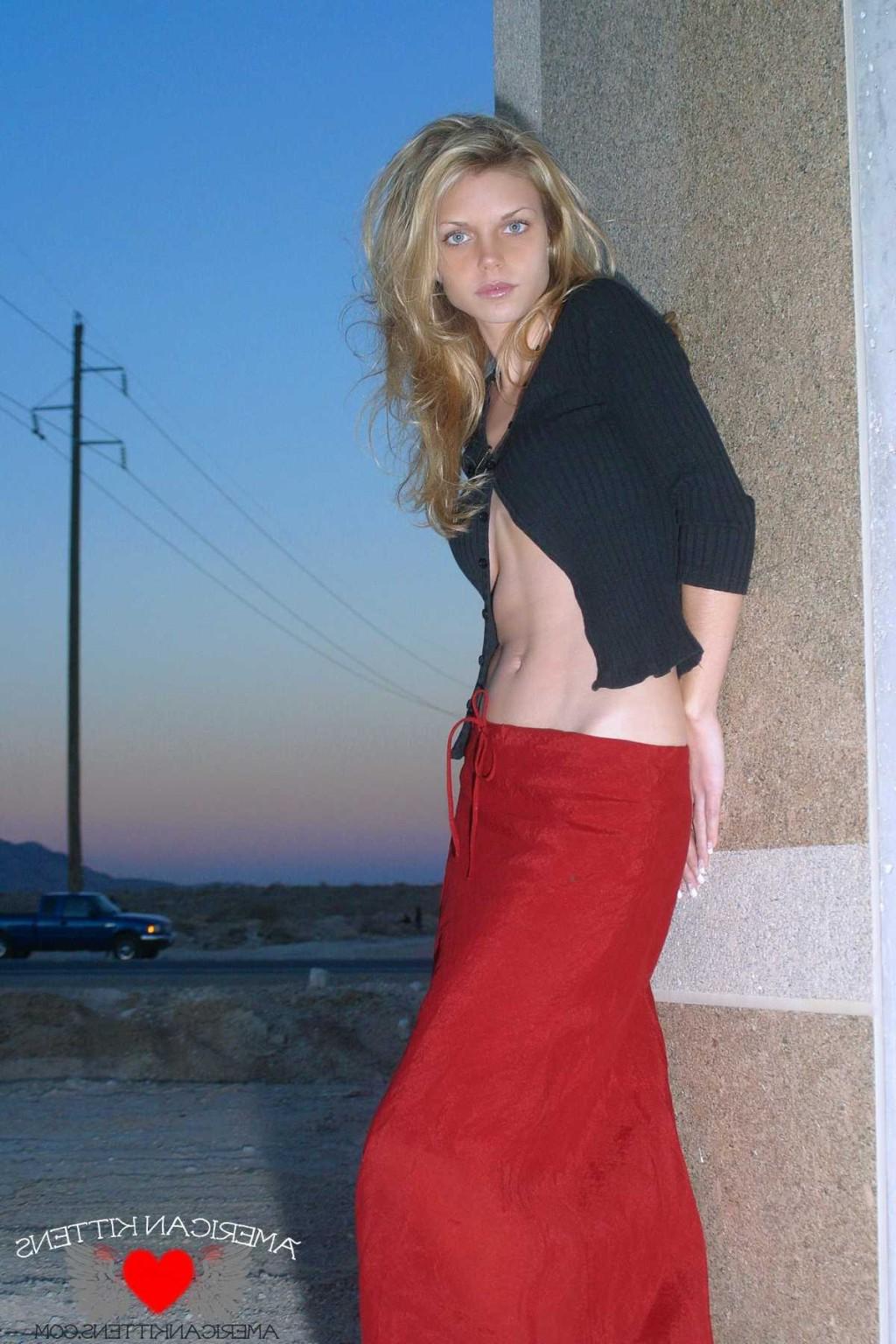 18P Ashley outside black top red long skirt