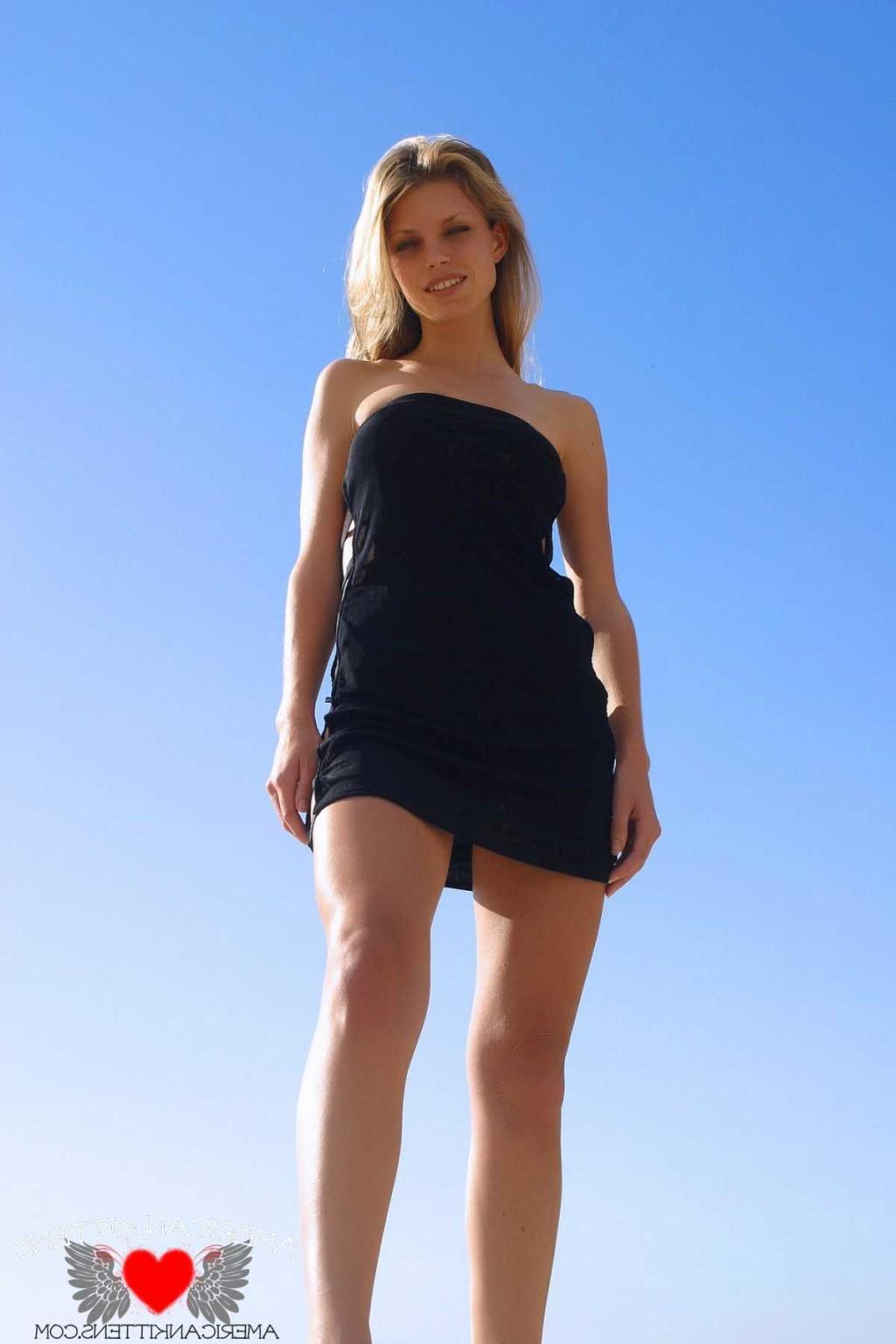 18P Ashley in a black dress outside