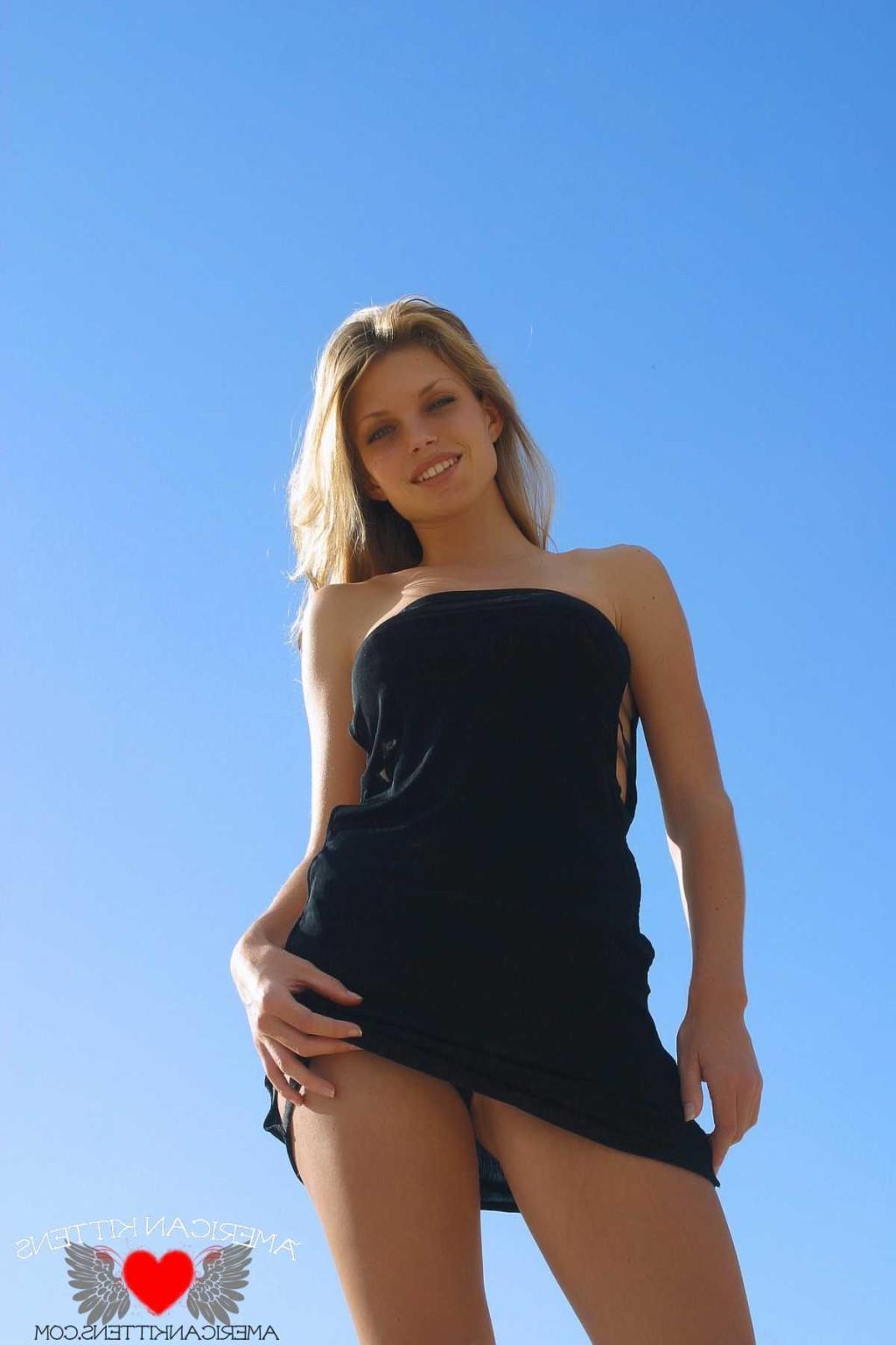 18P Ashley in a black dress outside