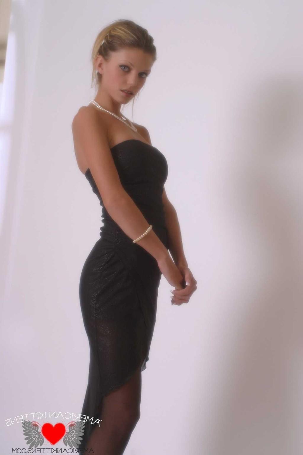 18P Ashley in a black dress and pearls