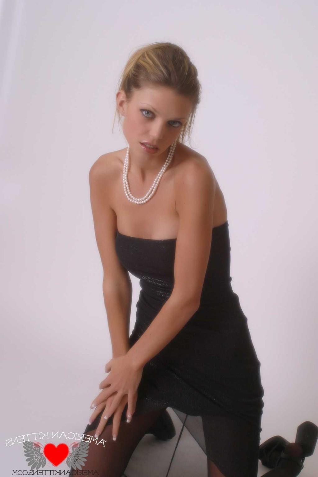 18P Ashley in a black dress and pearls