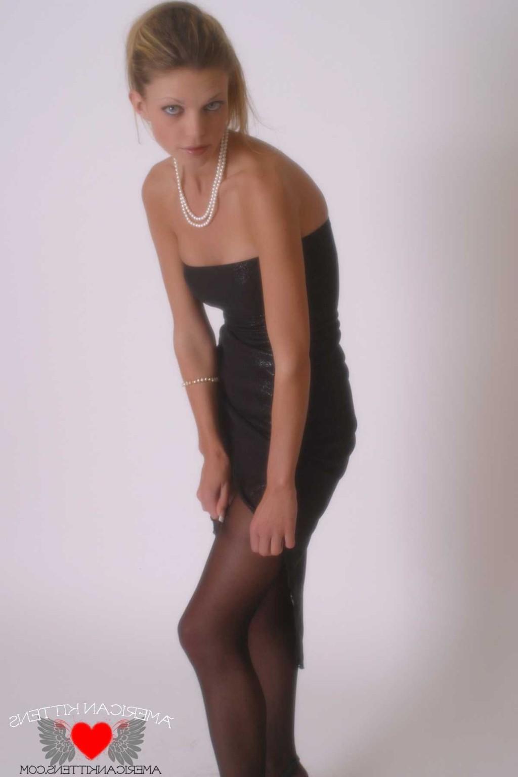 18P Ashley in a black dress and pearls