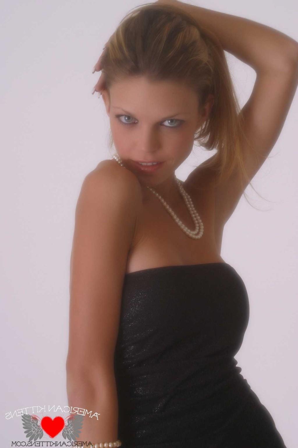 18P Ashley in a black dress and pearls