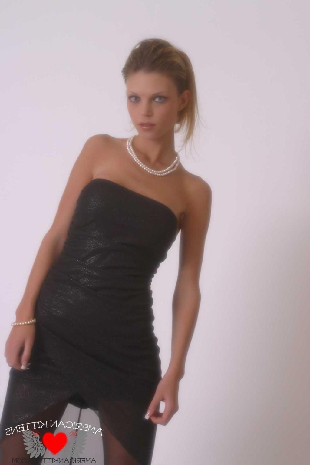18P Ashley in a black dress and pearls