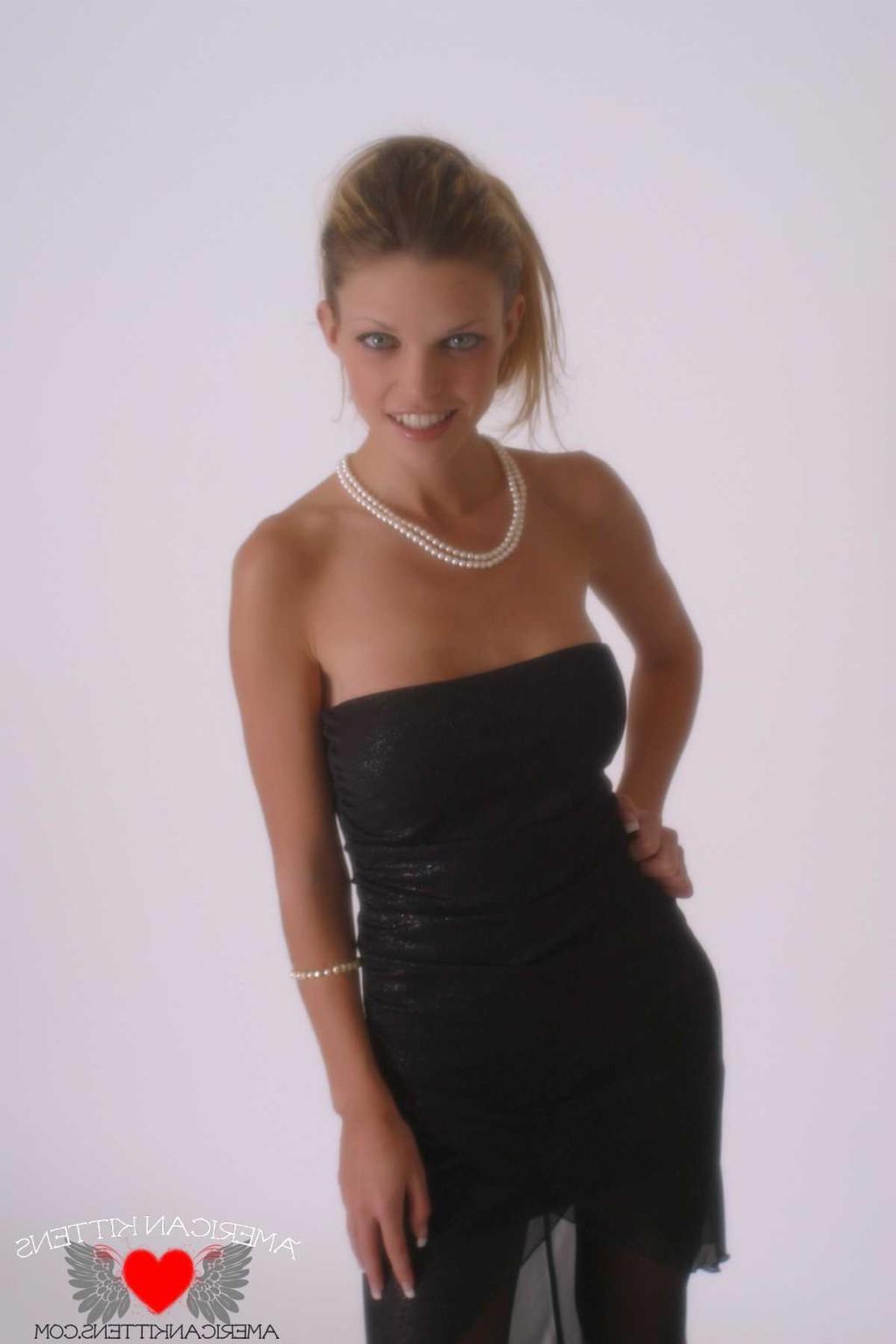 18P Ashley in a black dress and pearls