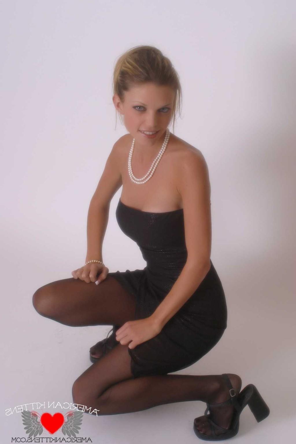 18P Ashley in a black dress and pearls