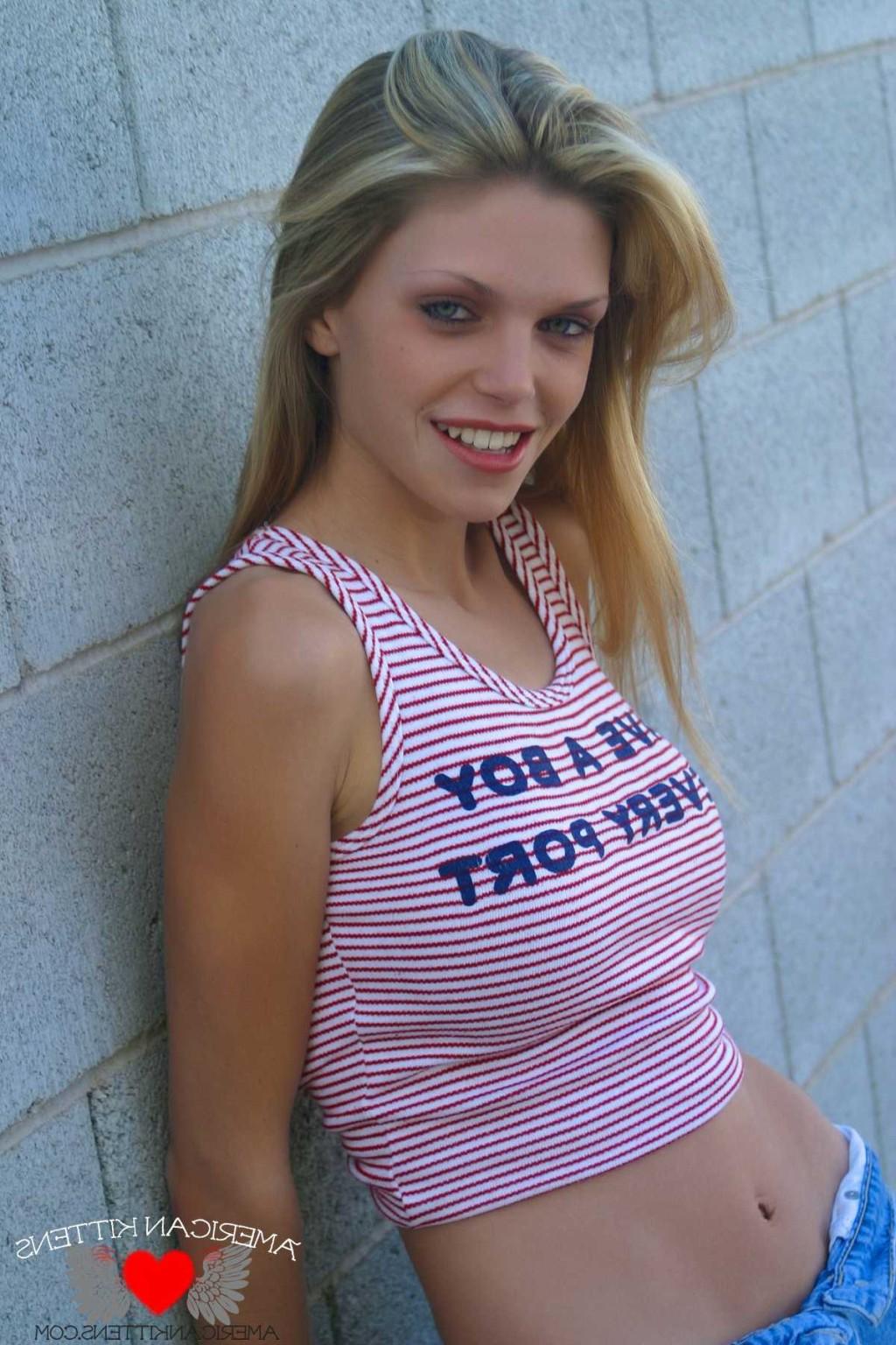18P Ashley A boy in every port t-shirt and jean shorts outside