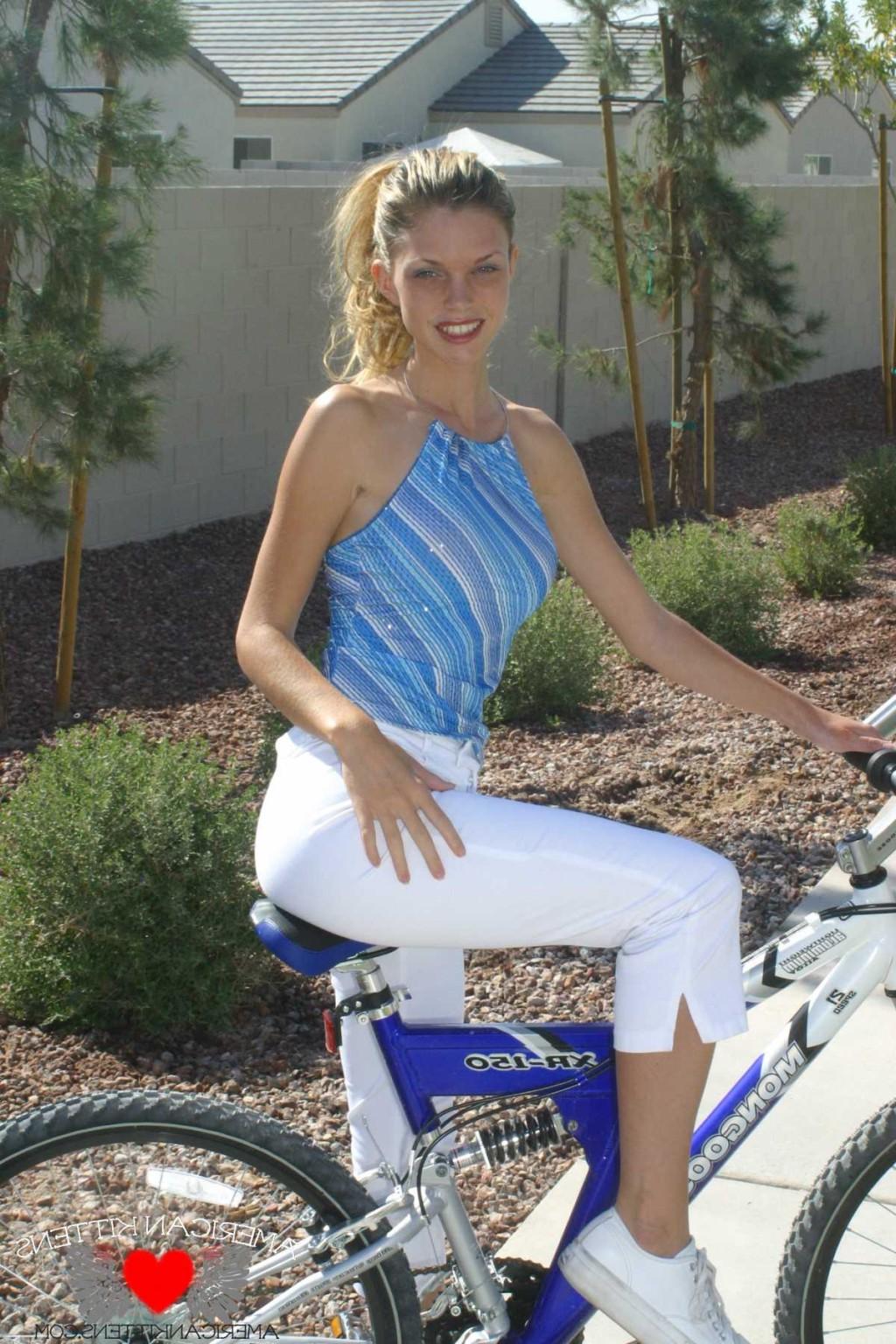 17P Ashley a blonde on a bike wearing white pants hot hot hot