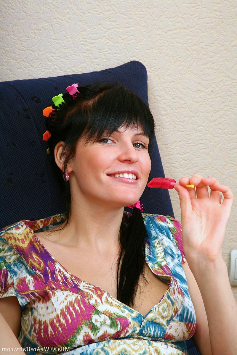 16P Gorgeous petite hirsute teen puts a lollipop in her hairy hole