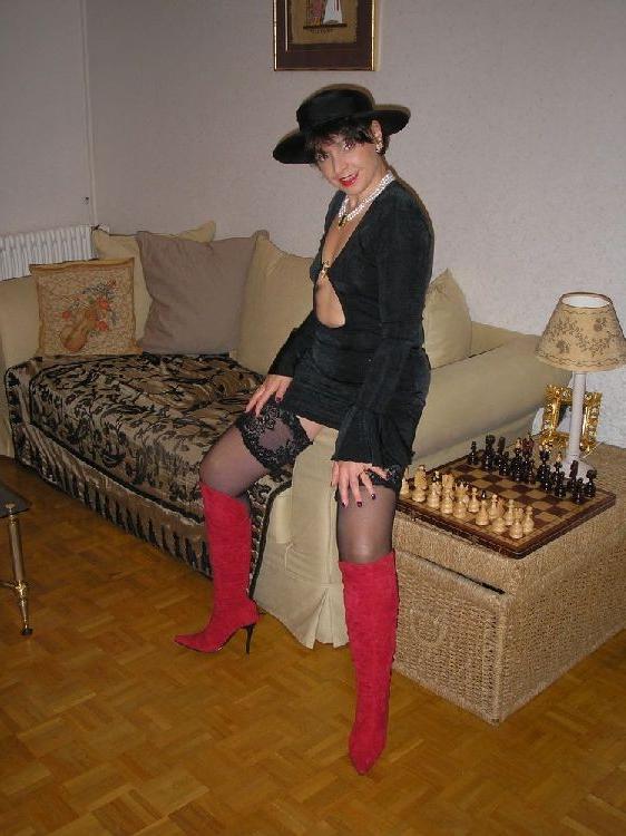 15P Amateur Nathalie posing in stockings and red boots