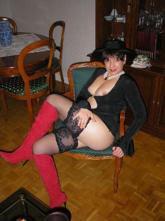 15P Amateur Nathalie posing in stockings and red boots