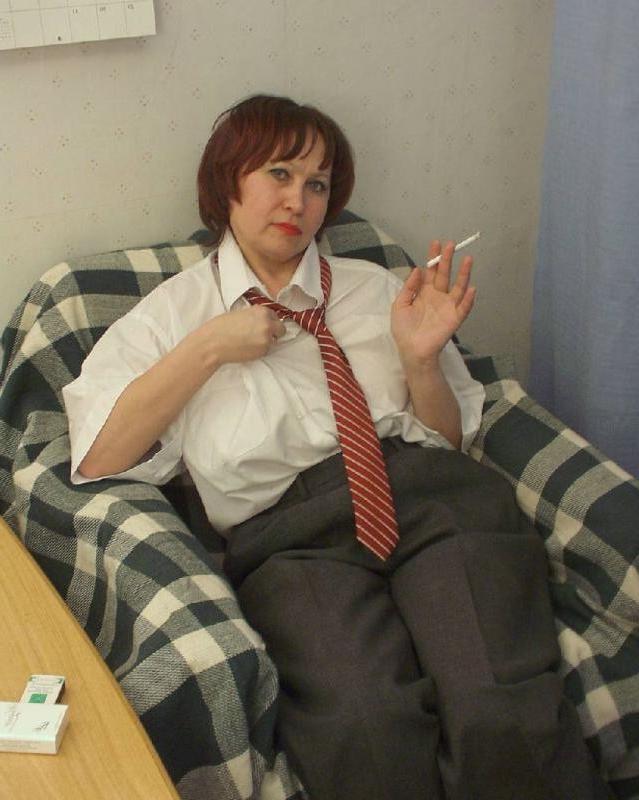 20P Horny smoking busty mature enjoys stripteasing while posing