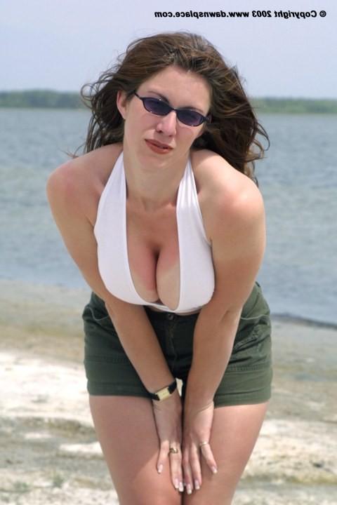 16P Horny wife pops out her huge tits on the beach