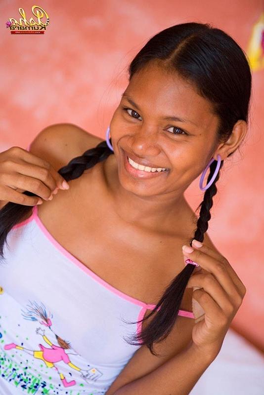 15P Sexy Indian girl Asha Kumara lays in bed with buns exposed