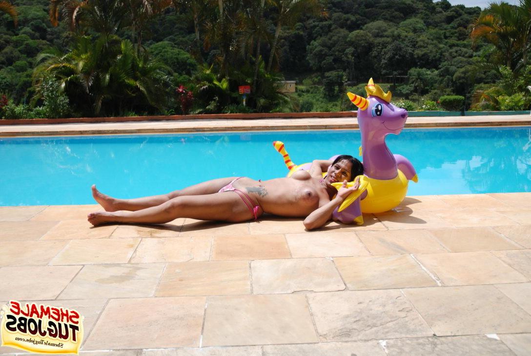 11P Sexy shemale playing with her cock poolside!