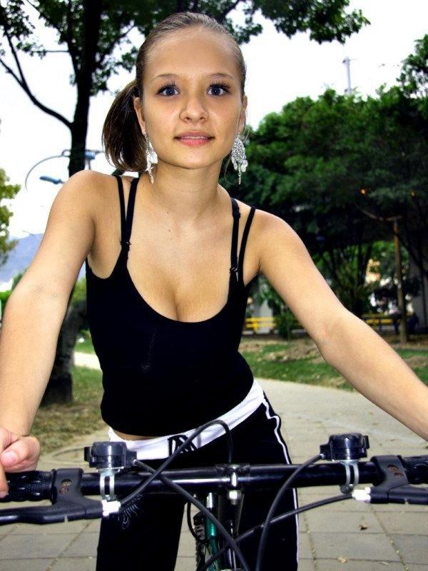 16P Paris Milan riding a bicycle showing cleavage