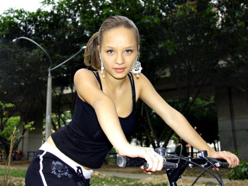16P Paris Milan riding a bicycle showing cleavage