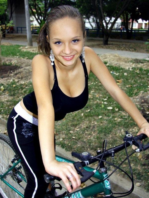 16P Paris Milan riding a bicycle showing cleavage