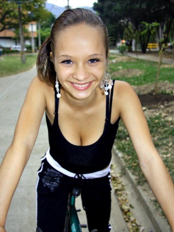 16P Paris Milan riding a bicycle showing cleavage