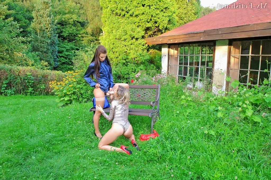 15P Couple of horny lesbians in the garden get wild with big strap o