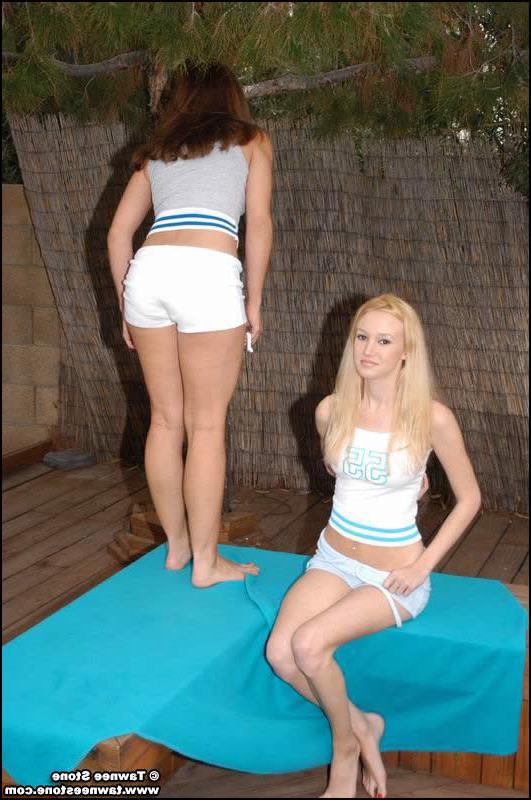 16P Two teens pull off their panties and show off their perky tits