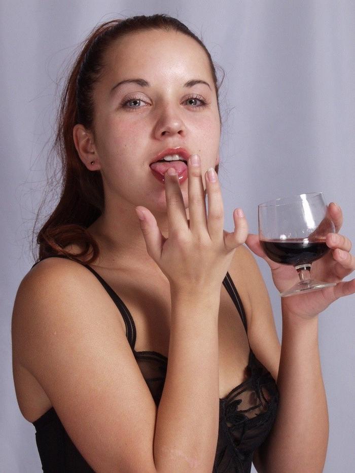 16P Cute petite brunette enjoying a glass of wine wearing lingerie and black stockin