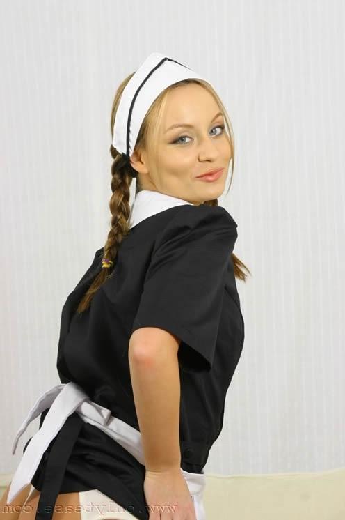 16P Sexy teen babe posing in a maid uniform