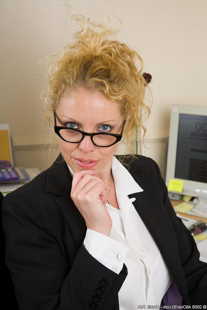 13P Blonde Taya shows off her massive breasts at her office