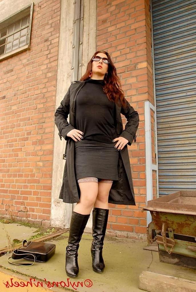 12P Redhead Lady Justine in stockings and boots