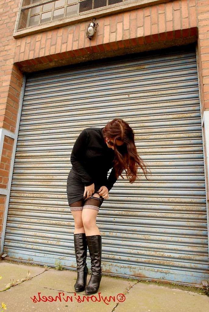 12P Redhead Lady Justine in stockings and boots