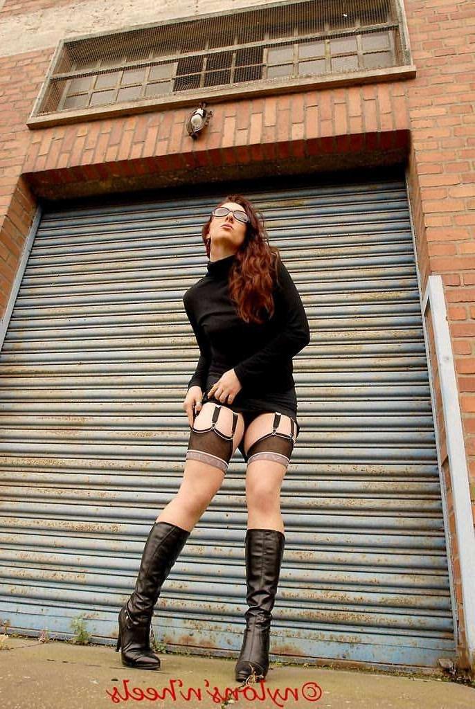12P Redhead Lady Justine in stockings and boots