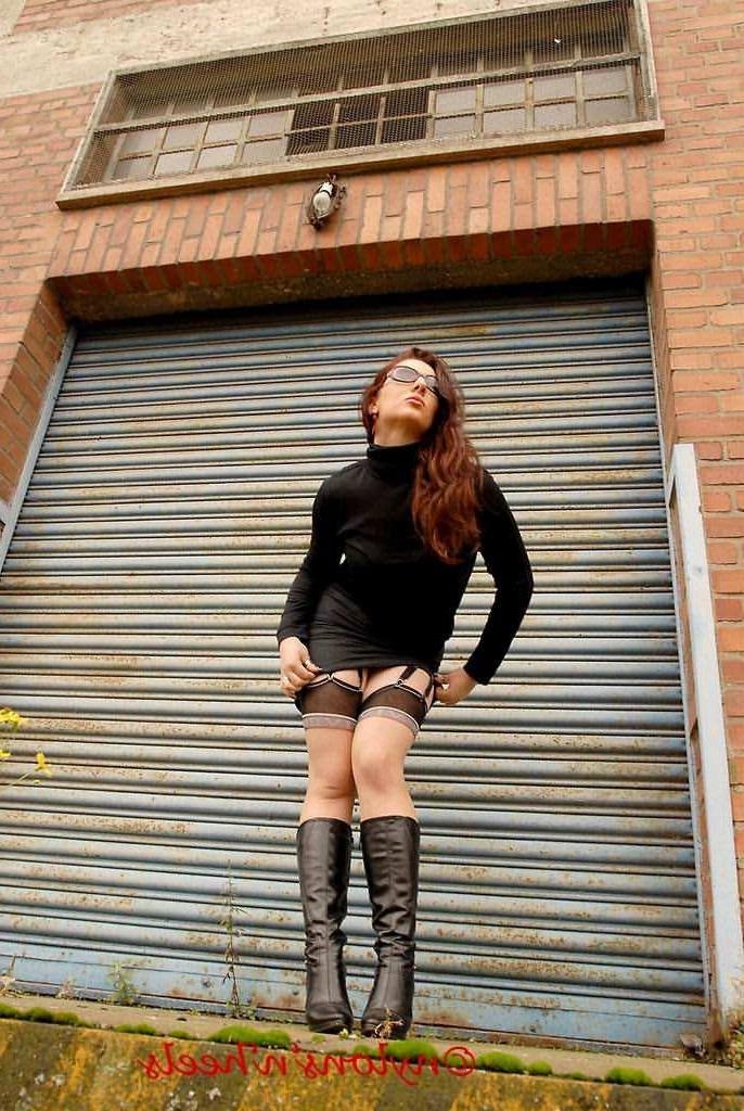 12P Redhead Lady Justine in stockings and boots