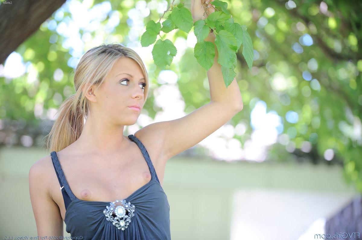 15P A cute petite amateur teenie toying pussy outdoors
