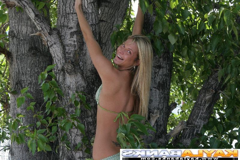 16P Playful teen climbs a tree and shows her perky tits off