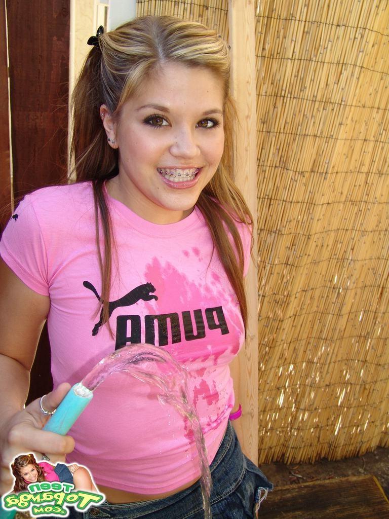 15P Naked eighteen year old with small tits drinks from garden hose