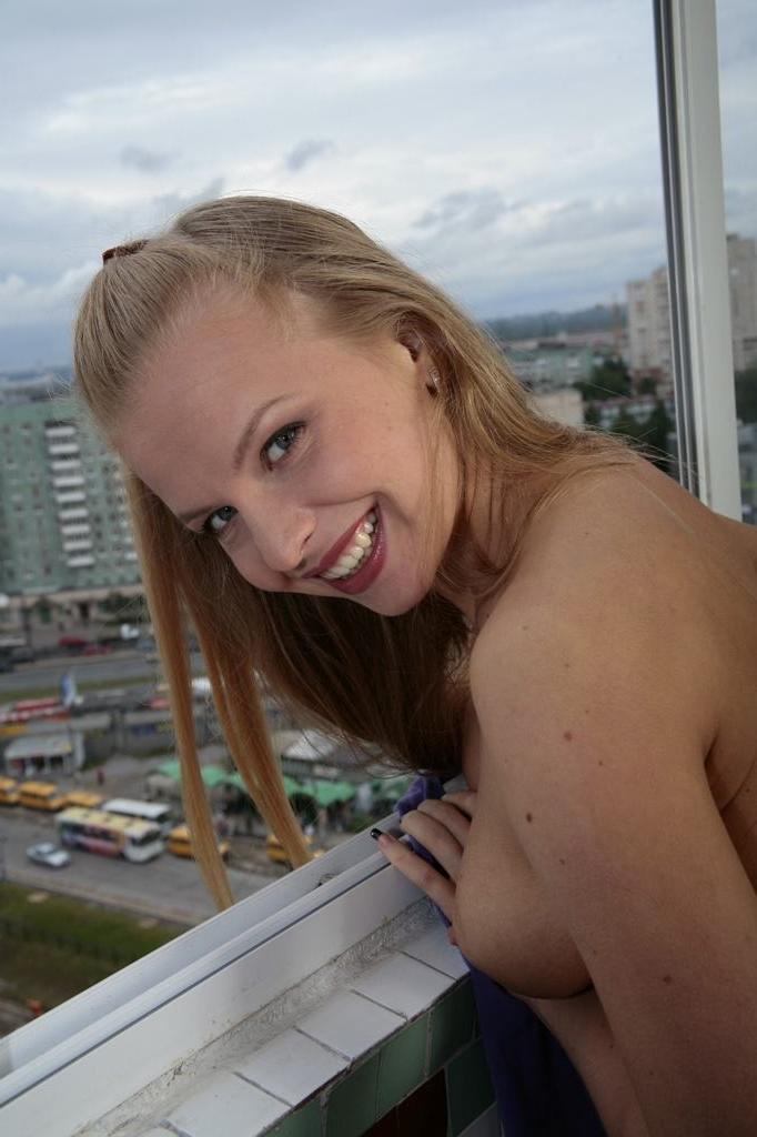 15P Cute blonde teen with perky tits strips naked while sightseeing