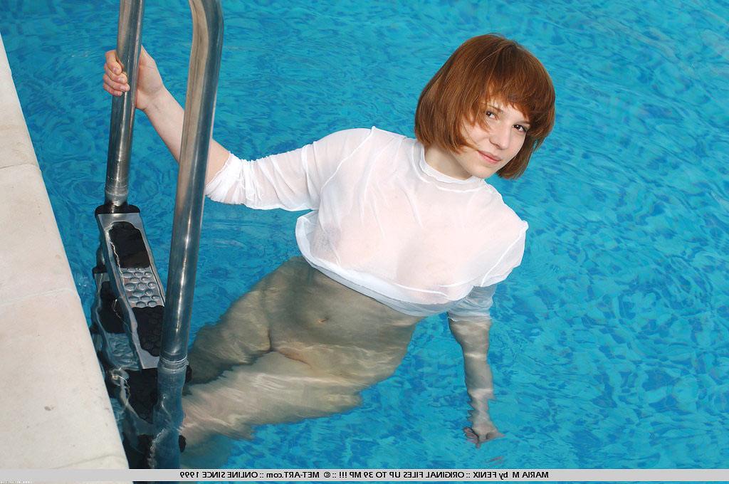 20P Sweet petite redhead teen skinny dipping in a pool