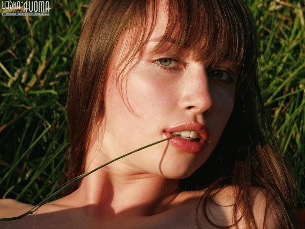 15P Small titted eighteen year old poses in the grass