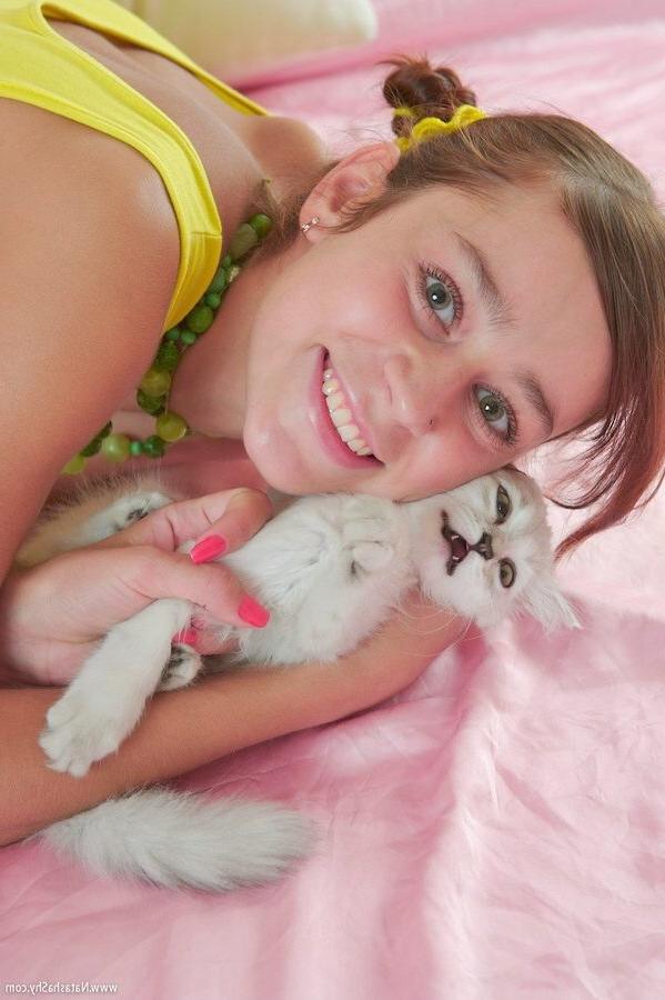 15P Petite Natasha Shy showing off her pussy in pink bed