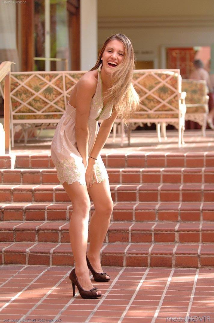 15P Cute petite teen exposing her shaven pussy outdoor