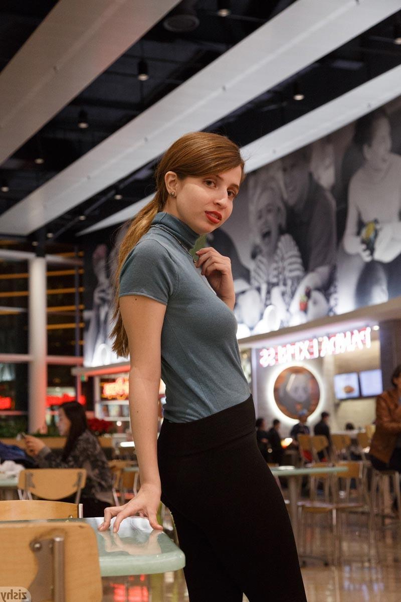 12P Cute redhead shows perky tits in the store