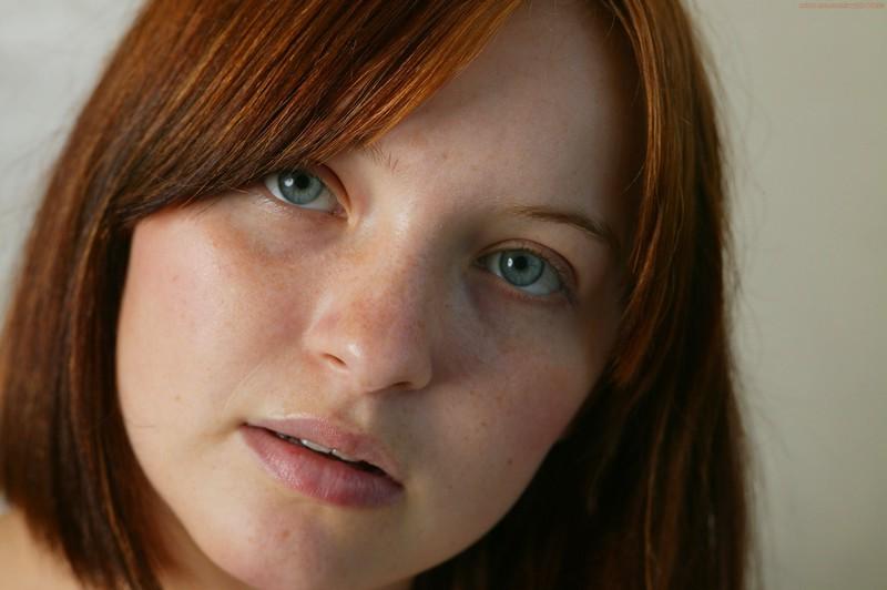16P Redhead girl undresses and shows pussy closeup