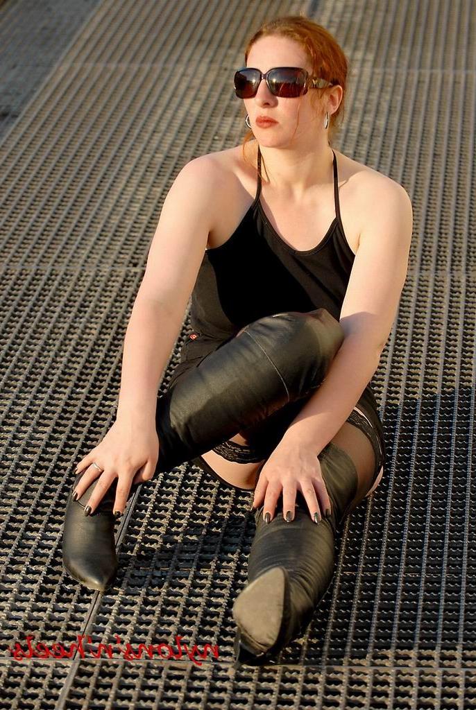 12P Amateur redhead in stockings and boots outdoors