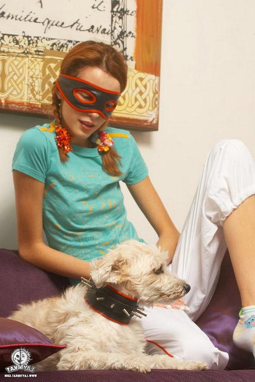 17P Pigtailed redhead in a mask pulls down her panties